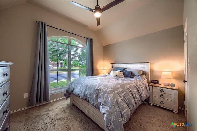 carpeted bedroom featuring baseboards, ceiling fan, and vaulted ceiling
