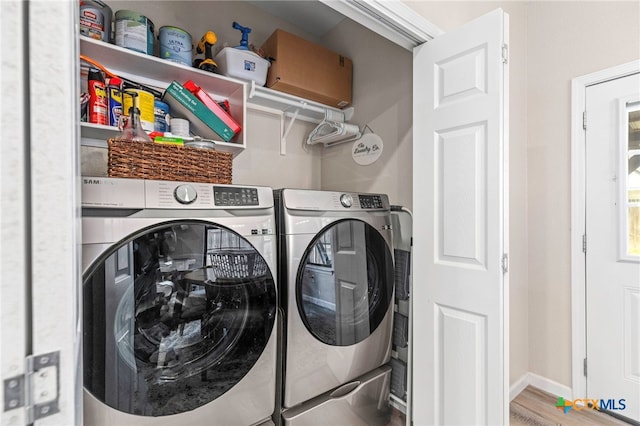 312 Holly Ave, Luling, TX 78648 - laundry area featuring independent washer and dryer and wood finished floors