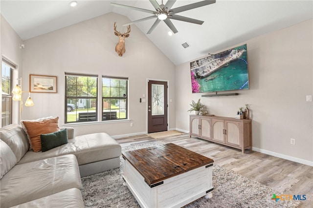 312 Holly Ave, Luling, TX 78648 - living room with a ceiling fan, wood finished floors, high vaulted ceiling, and recessed lighting