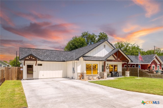 312 Holly Ave, Luling, TX 78648 - modern inspired farmhouse featuring driveway, a shingled roof, stone siding, and board and batten siding