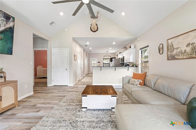 312 Holly Ave, Luling, TX 78648 - living area featuring light wood-style floors, a ceiling fan, high vaulted ceiling, and recessed lighting
