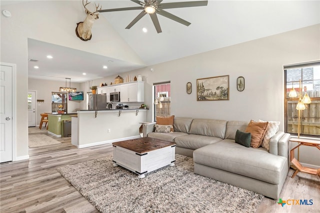 312 Holly Ave, Luling, TX 78648 - living room with a ceiling fan, light wood finished floors, recessed lighting, and high vaulted ceiling