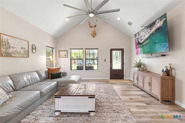 312 Holly Ave, Luling, TX 78648 - living room featuring ceiling fan, light wood finished floors, high vaulted ceiling, and recessed lighting