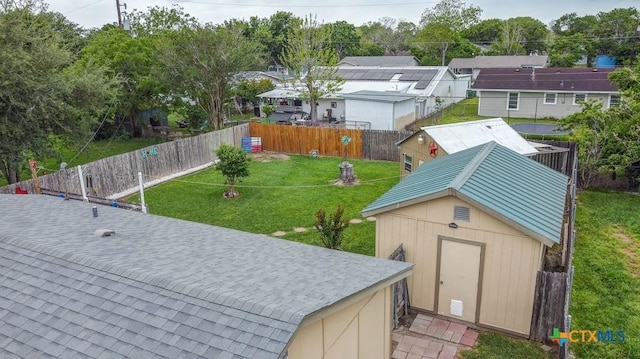 2812 Curlew St, Victoria, TX 77901 - fenced backyard featuring a storage unit