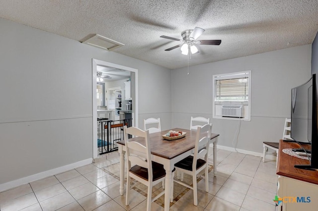 2812 Curlew St, Victoria, TX 77901 - dining area featuring attic access, a ceiling fan, cooling unit, light tile patterned floors, and a textured ceiling