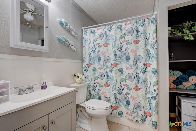 2812 Curlew St, Victoria, TX 77901 - full bath featuring vanity, a textured ceiling, a textured wall, tile patterned floors, and a shower with shower curtain