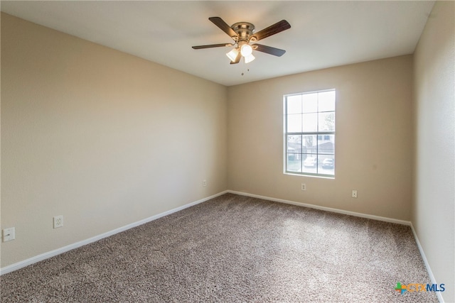 spare room with carpet flooring and ceiling fan