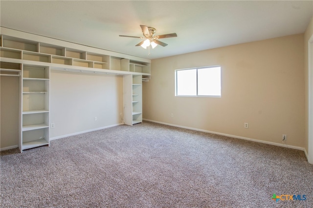 unfurnished bedroom featuring carpet flooring, ceiling fan, and a closet