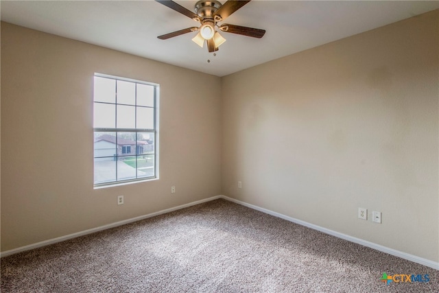 unfurnished room with ceiling fan and carpet floors