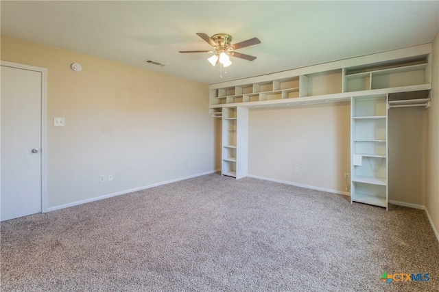 unfurnished bedroom with carpet flooring, ceiling fan, and a closet