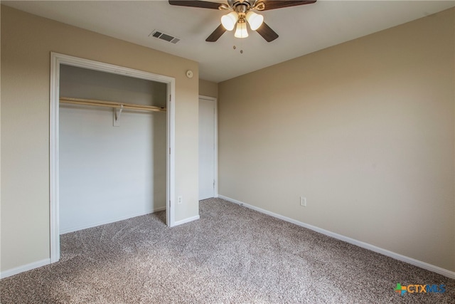 unfurnished bedroom with carpet floors, a closet, and ceiling fan