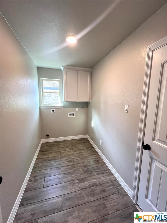 laundry room featuring cabinets, washer hookup, hookup for an electric dryer, and dark hardwood / wood-style flooring