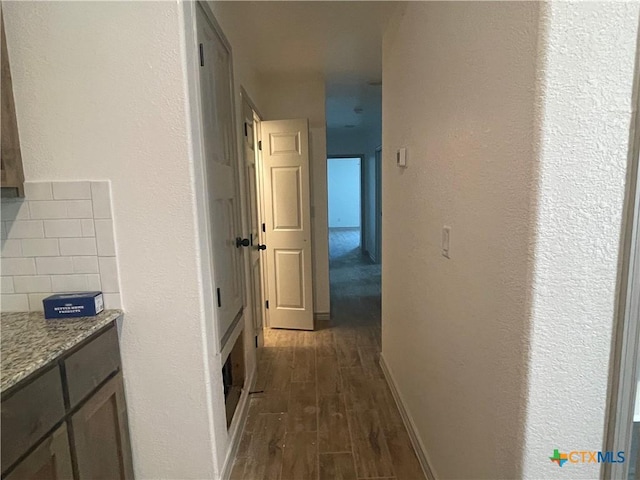 2408 Duntov Dr, Temple, TX 76504 - hallway with dark wood-style floors and baseboards