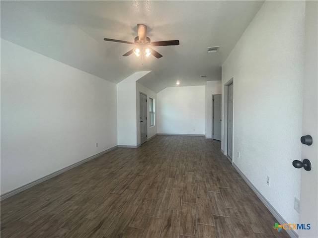 2408 Duntov Dr, Temple, TX 76504 - spare room with dark wood-style floors, ceiling fan, baseboards, and lofted ceiling