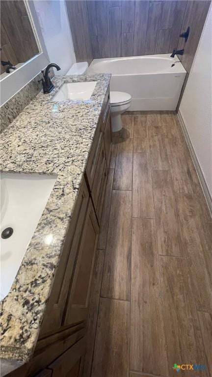2408 Duntov Dr, Temple, TX 76504 - full bathroom with hardwood / wood-style flooring, double vanity, and toilet