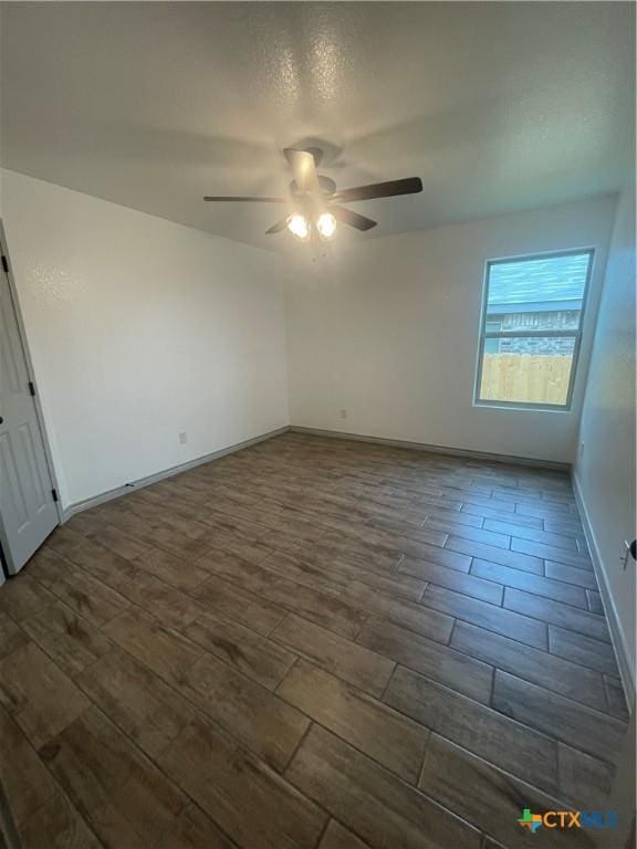 2408 Duntov Dr, Temple, TX 76504 - unfurnished room featuring a ceiling fan, dark wood-type flooring, and baseboards