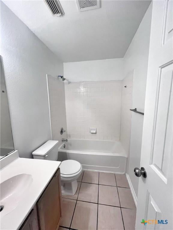 bathroom with tile patterned floors, visible vents, toilet, and vanity