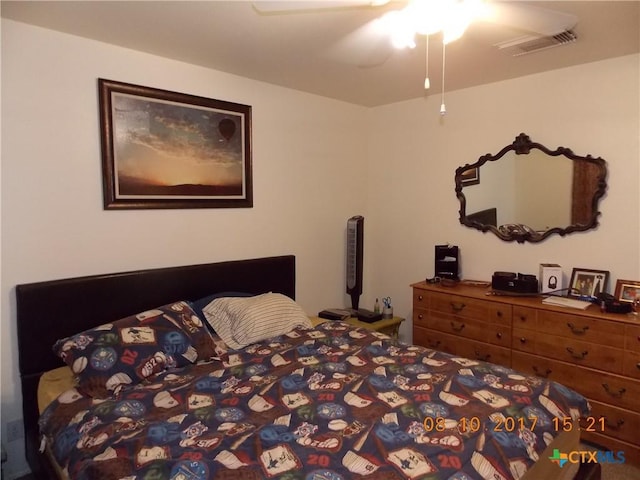 bedroom featuring visible vents and ceiling fan