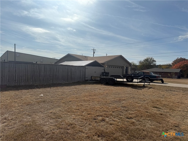 view of yard with a garage