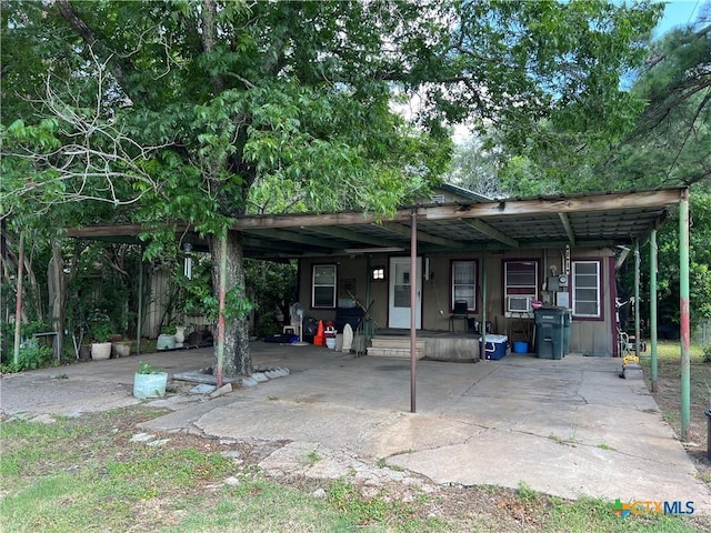 view of parking / parking lot with a carport