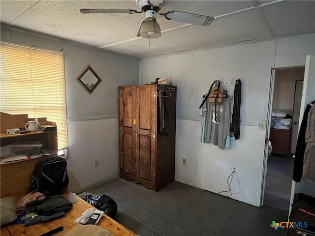 office space featuring a textured ceiling and ceiling fan