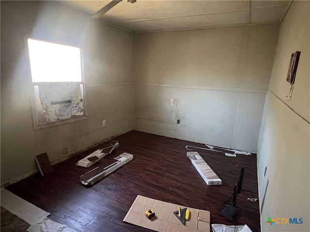 empty room featuring dark wood-type flooring