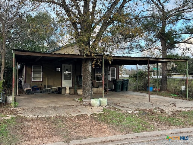 view of front of home with a carport