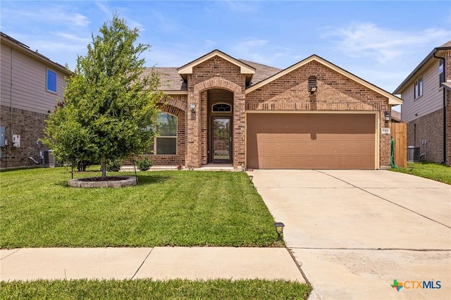 853 Hobby Rd, Copperas Cove, TX 76522 - view of front facade with brick siding, a garage, a front lawn, concrete driveway, and cooling unit