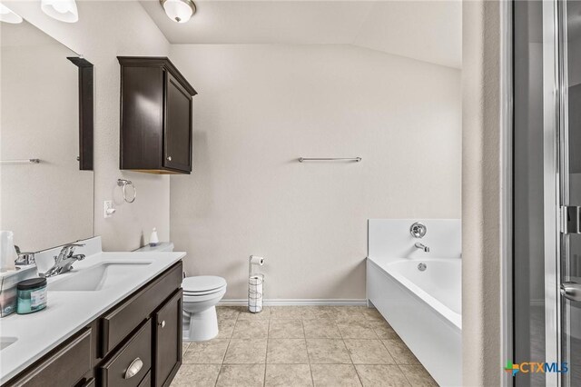 853 Hobby Rd, Copperas Cove, TX 76522 - bathroom featuring double vanity, a bath, toilet, vaulted ceiling, and tile patterned floors