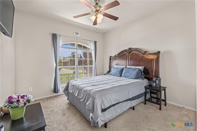 853 Hobby Rd, Copperas Cove, TX 76522 - bedroom with light carpet, baseboards, and a ceiling fan