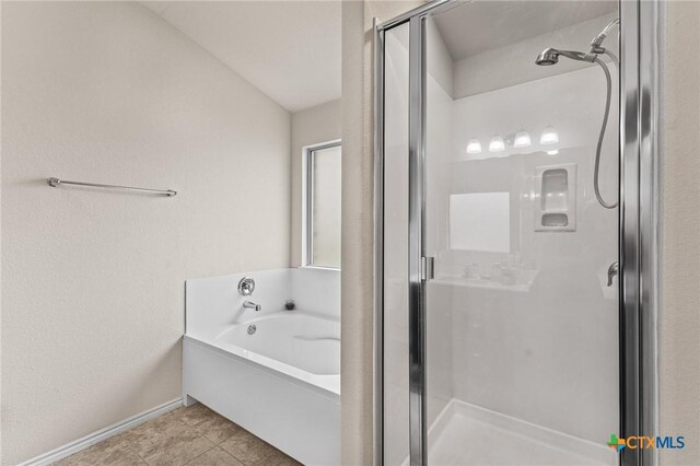 853 Hobby Rd, Copperas Cove, TX 76522 - bathroom with a stall shower, a garden tub, tile patterned floors, and baseboards