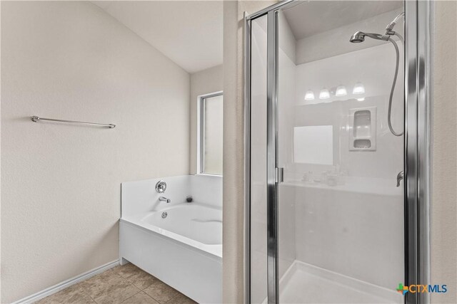 853 Hobby Rd, Copperas Cove, TX 76522 - bathroom featuring a shower stall, a bath, baseboards, and tile patterned floors