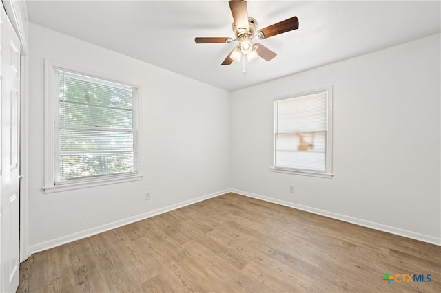 unfurnished room with light hardwood / wood-style floors and ceiling fan