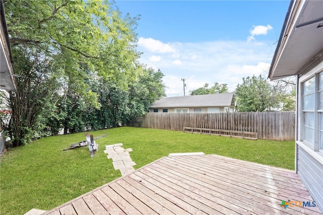 deck featuring a lawn