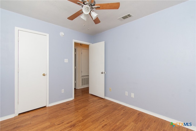 unfurnished bedroom featuring ceiling fan and light hardwood / wood-style flooring