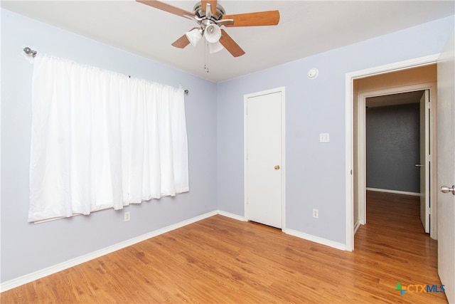 unfurnished room with light hardwood / wood-style flooring and ceiling fan