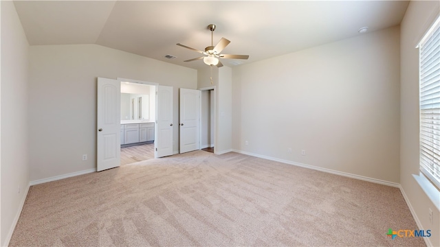 unfurnished bedroom featuring light colored carpet, multiple windows, and visible vents