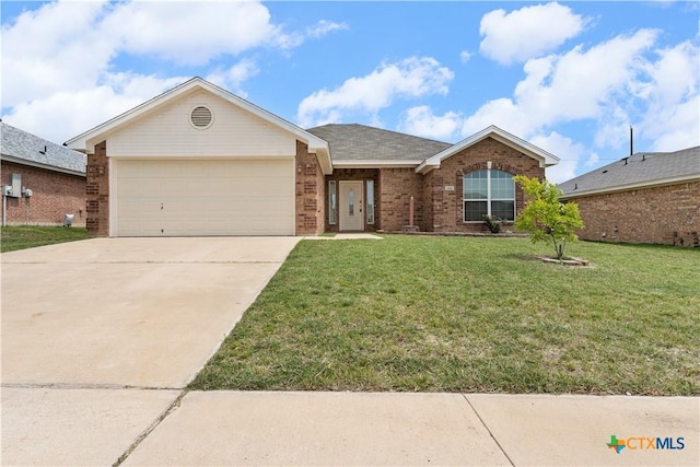 3511 Llano Estacado Ct, Killeen, TX 76549 - ranch-style home featuring brick siding, an attached garage, concrete driveway, and a front yard
