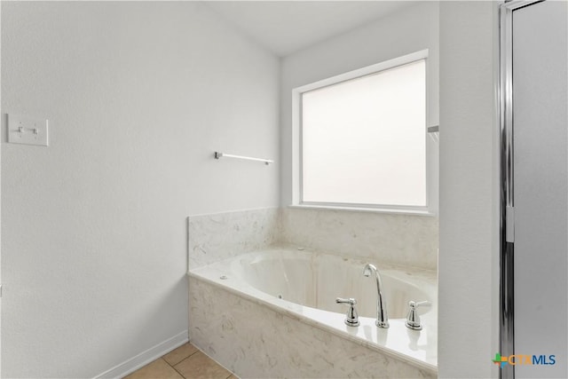 3511 Llano Estacado Ct, Killeen, TX 76549 - bathroom with a garden tub and tile patterned flooring