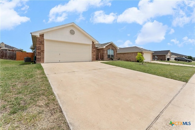 3511 Llano Estacado Ct, Killeen, TX 76549 - ranch-style home featuring brick siding, concrete driveway, central air condition unit, and an attached garage