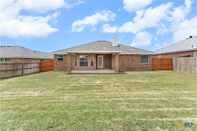 3511 Llano Estacado Ct, Killeen, TX 76549 - back of property with brick siding, a patio, and a chimney