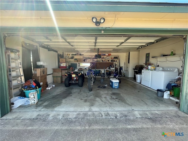 garage with washing machine and dryer