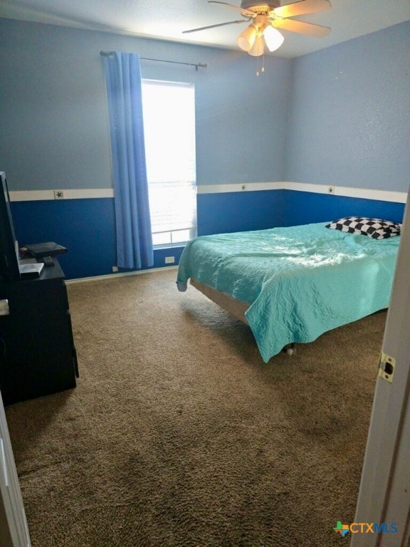 bedroom featuring ceiling fan and carpet floors