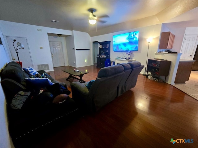 living room featuring ceiling fan and wood-type flooring