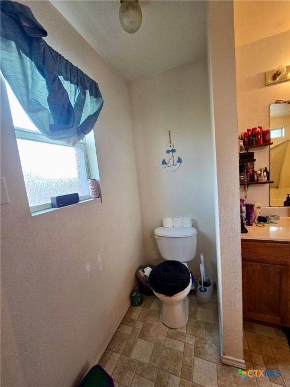 bathroom with vanity and toilet