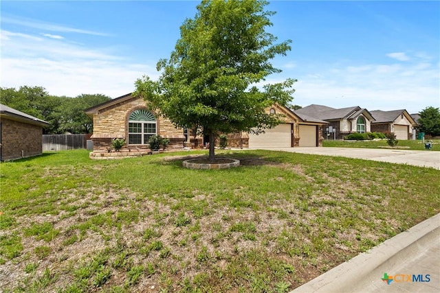 2034 Falling Leaf Ln, Harker Heights, TX 76548 - view of front facade featuring driveway, a front yard, a garage, fence, and stone siding