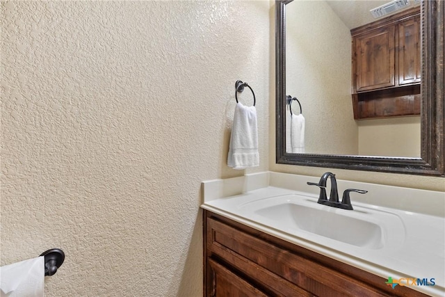 2034 Falling Leaf Ln, Harker Heights, TX 76548 - bathroom with vanity, a textured wall, and visible vents