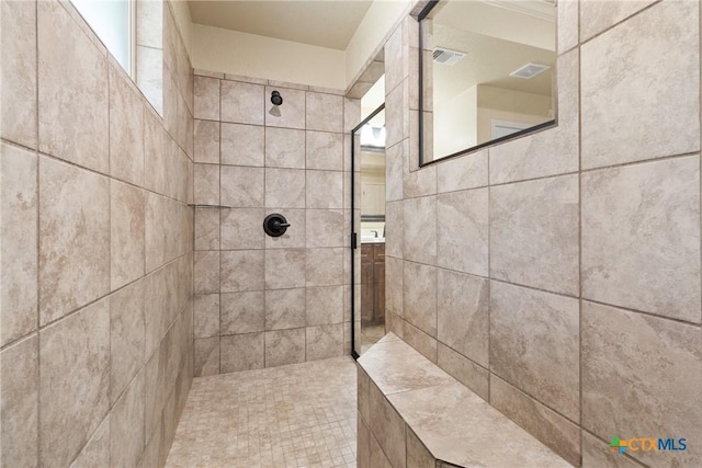 2034 Falling Leaf Ln, Harker Heights, TX 76548 - bathroom with visible vents, a healthy amount of sunlight, and tiled shower