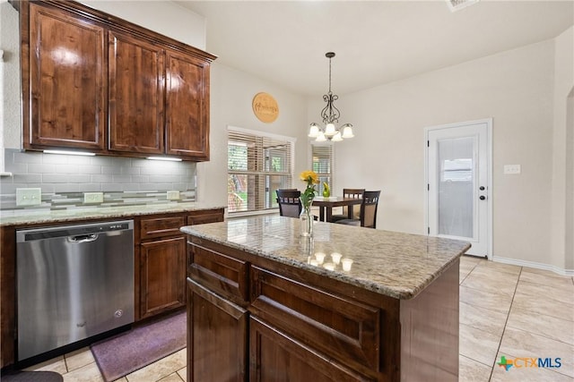 2034 Falling Leaf Ln, Harker Heights, TX 76548 - kitchen with backsplash, dishwasher, light tile patterned floors, light stone counters, and a chandelier