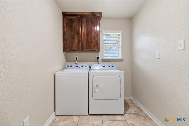2034 Falling Leaf Ln, Harker Heights, TX 76548 - laundry room with light tile patterned floors, baseboards, cabinet space, and washer and dryer